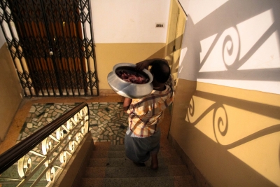 Azad Mama carrying meat for distribution