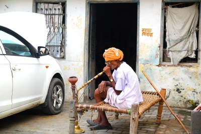 Old man smoking hookah