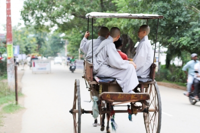 Monks in rickshaw