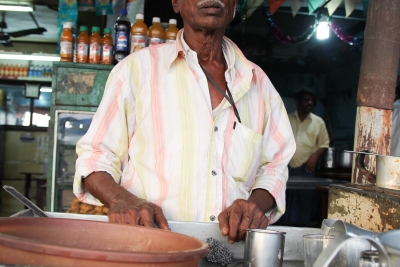 Dhant Bani with a freshly brewed glass of strong tea.