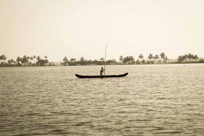 A fisherman tries his luck in Vembanad Lake, Kerala.